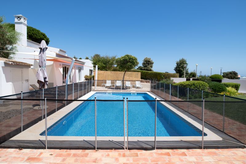 Family Enjoying Pool with Mesh Fence in Place
